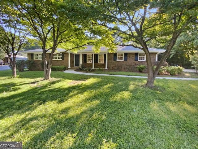 ranch-style home with a front yard