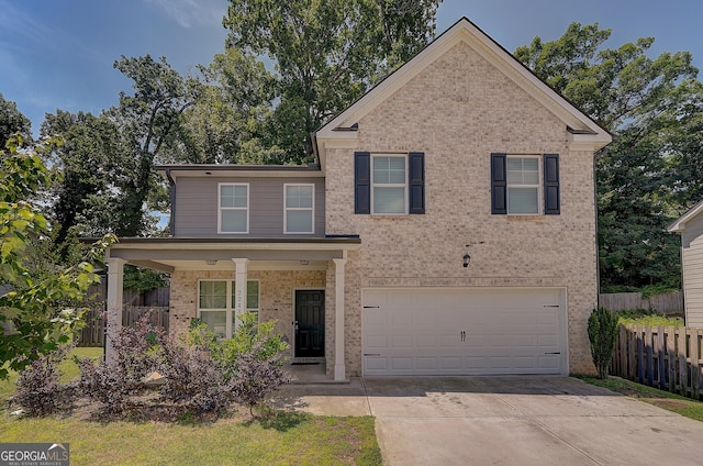 view of front of house featuring a garage and covered porch