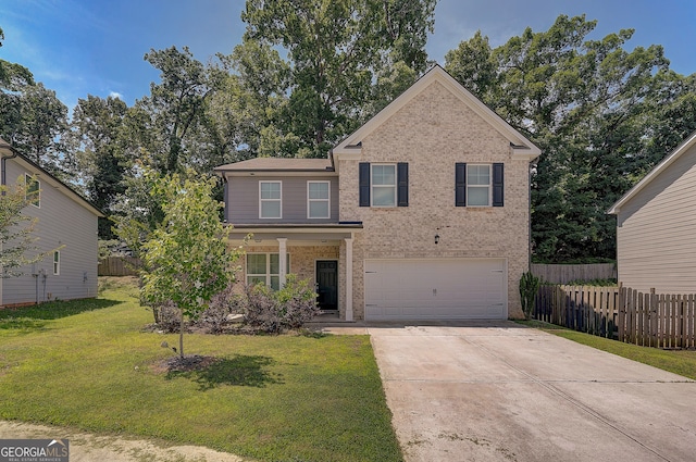 view of property featuring a garage and a front yard