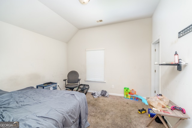 bedroom with carpet floors and vaulted ceiling