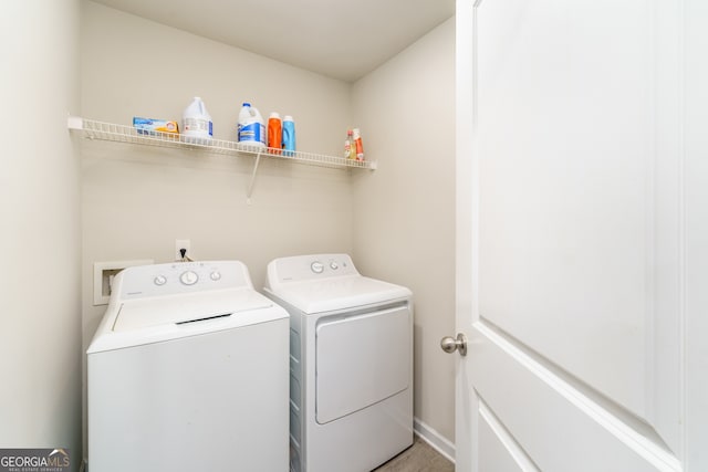 washroom with independent washer and dryer