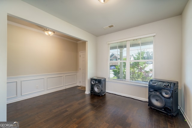 unfurnished room featuring dark wood-type flooring