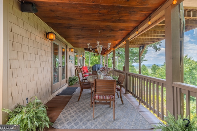 sunroom with a wealth of natural light and wooden ceiling