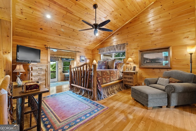 bedroom featuring hardwood / wood-style flooring, wooden ceiling, multiple windows, and wooden walls