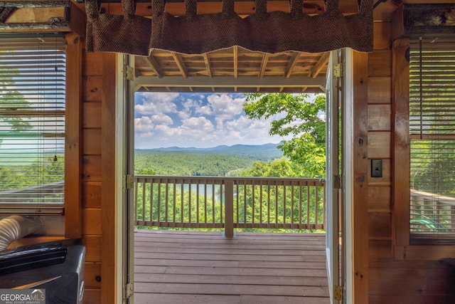 doorway to outside featuring a mountain view