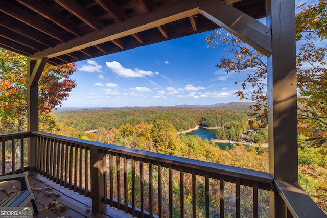 wooden deck featuring a water view