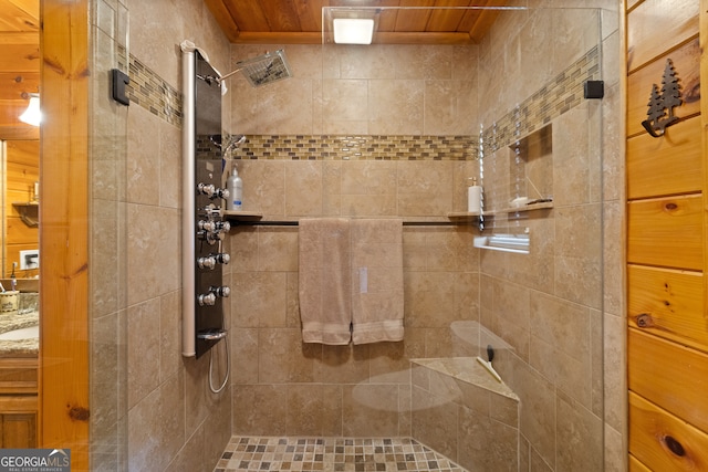 bathroom with a tile shower