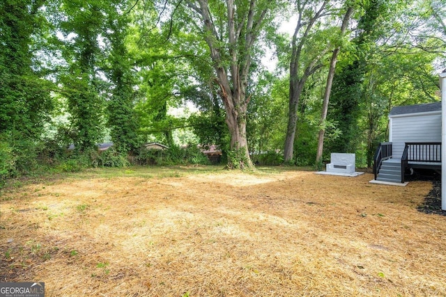 view of yard featuring a deck