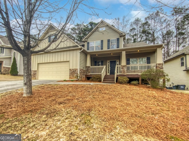 craftsman-style home with a porch and a garage