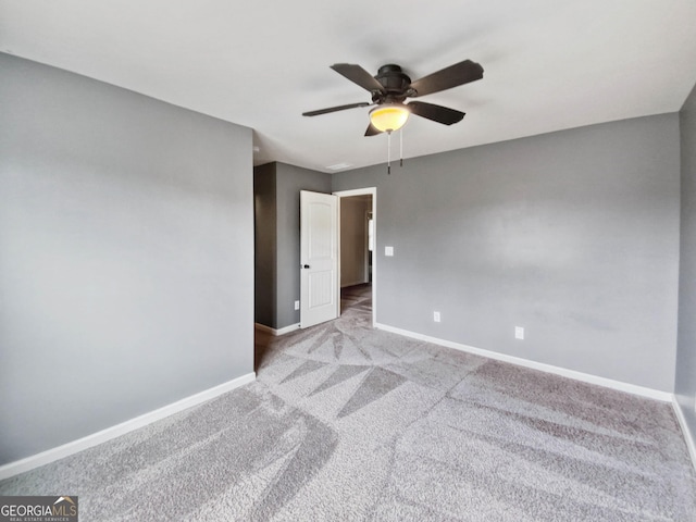 carpeted empty room with ceiling fan