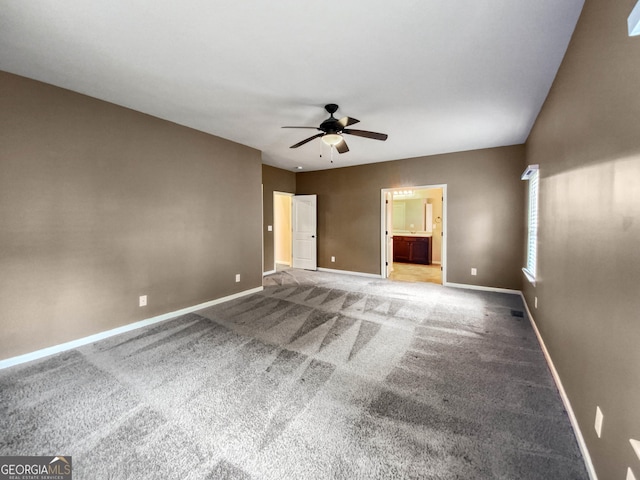 unfurnished room featuring carpet flooring and ceiling fan