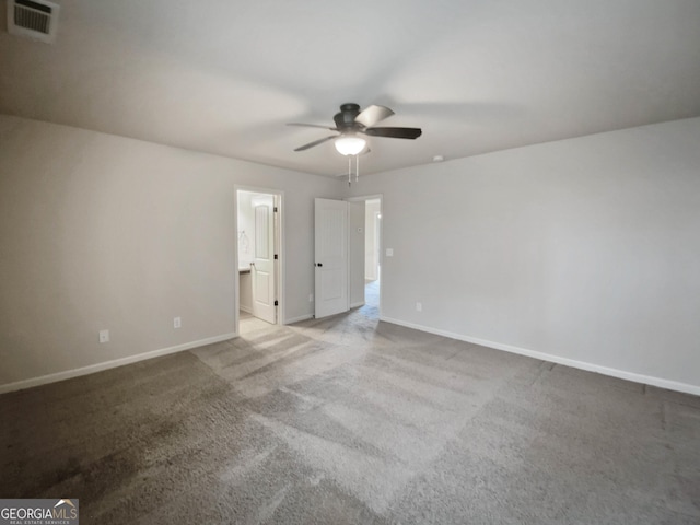 empty room with ceiling fan and carpet