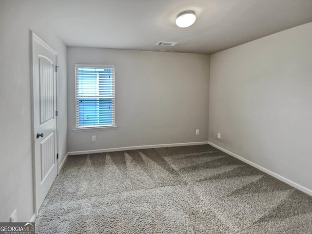 unfurnished room featuring carpet floors