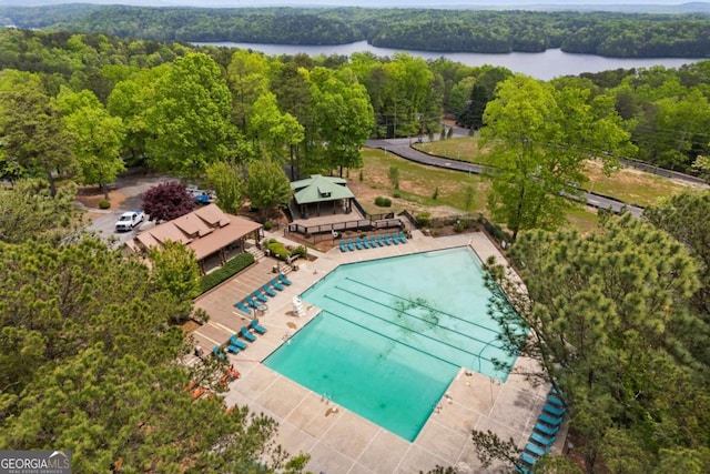 view of pool featuring a water view