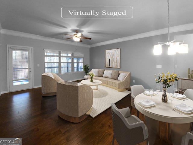 living room featuring a notable chandelier, dark hardwood / wood-style flooring, and ornamental molding