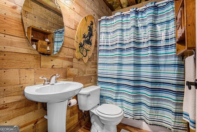 104 Streambank Ct, Temple, GA 30179 - full bathroom with wood walls, toilet, and curtained shower