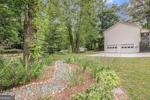 104 Streambank Ct, Temple, GA 30179 - view of green lawn with a garage and concrete driveway