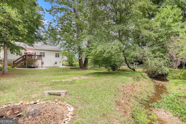 104 Streambank Ct, Temple, GA 30179 - view of grassy yard featuring stairs and a wooden deck
