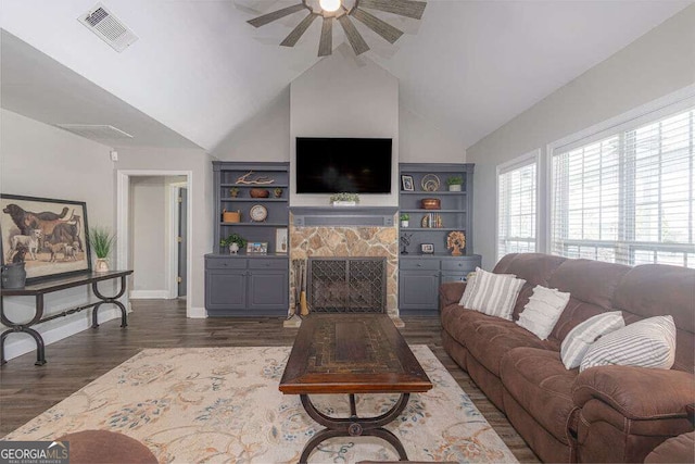 1985 Roscoe Rd, Newnan, GA 30263 - living area with visible vents, lofted ceiling, ceiling fan, wood finished floors, and a fireplace