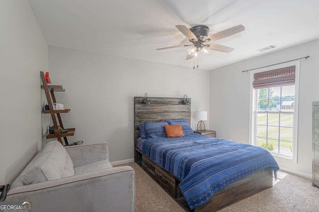 1985 Roscoe Rd, Newnan, GA 30263 - bedroom with baseboards, visible vents, ceiling fan, and carpet flooring