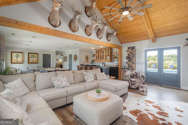 1985 Roscoe Rd, Newnan, GA 30263 - living area with wooden ceiling, beamed ceiling, wood finished floors, wet bar, and french doors