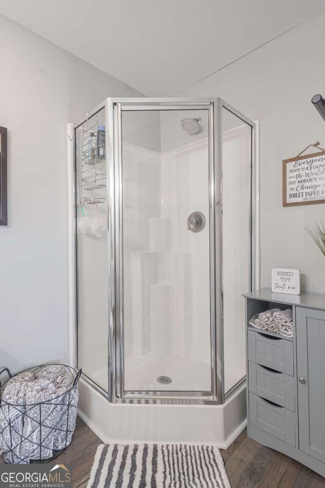 1985 Roscoe Rd, Newnan, GA 30263 - full bathroom featuring a stall shower and wood finished floors