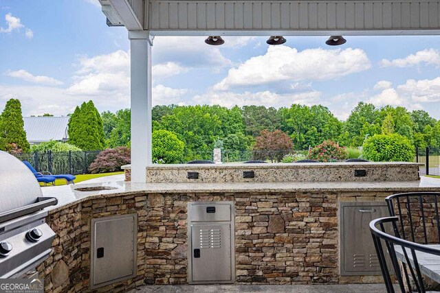 1985 Roscoe Rd, Newnan, GA 30263 - view of patio featuring grilling area, area for grilling, and fence