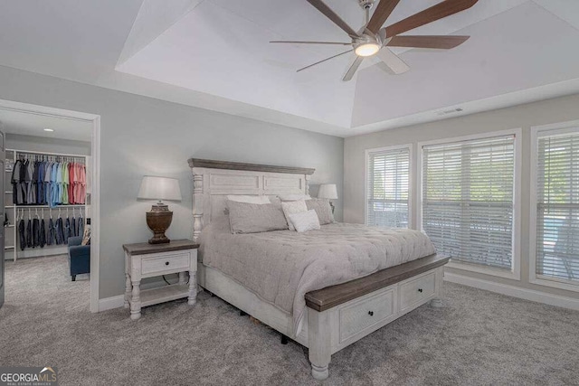 1985 Roscoe Rd, Newnan, GA 30263 - carpeted bedroom featuring visible vents, baseboards, a ceiling fan, a spacious closet, and vaulted ceiling