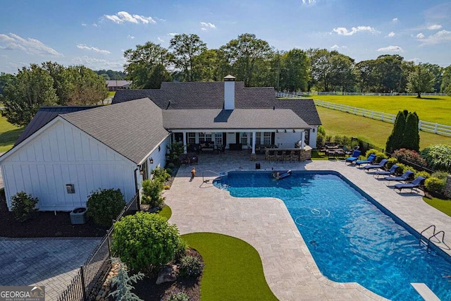 1985 Roscoe Rd, Newnan, GA 30263 - pool featuring a fenced backyard, a patio, central AC, and a lawn