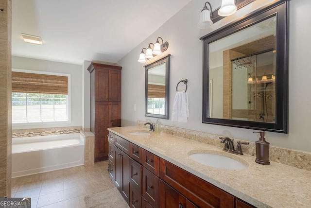 1985 Roscoe Rd, Newnan, GA 30263 - full bath with double vanity, a garden tub, a sink, and tile patterned floors