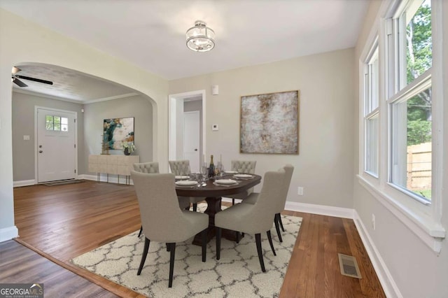 dining area featuring dark hardwood / wood-style flooring and a healthy amount of sunlight