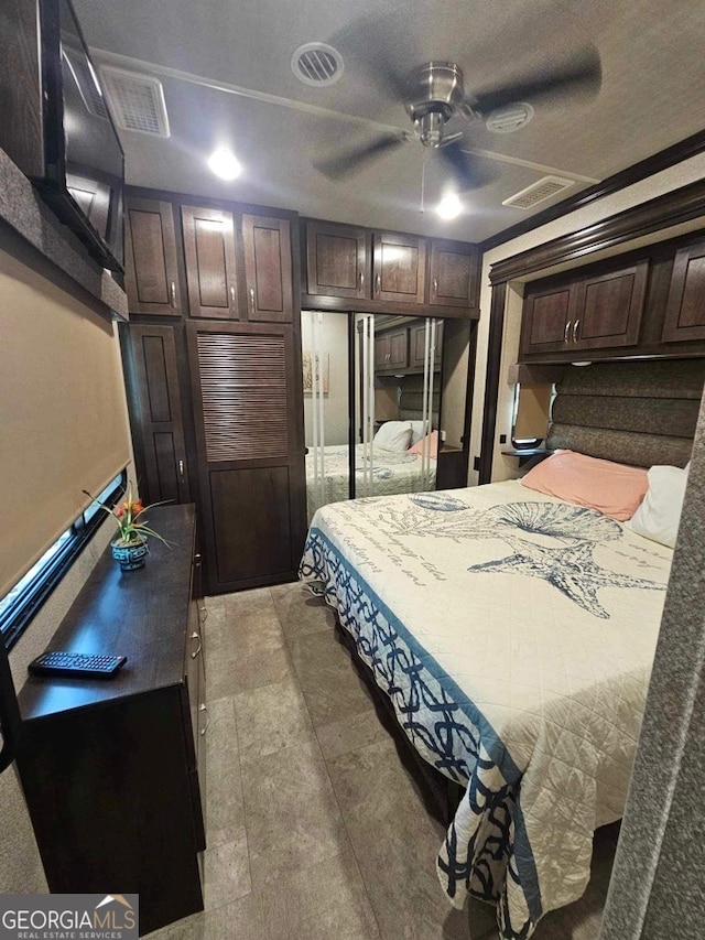 bedroom featuring tile patterned flooring and ceiling fan