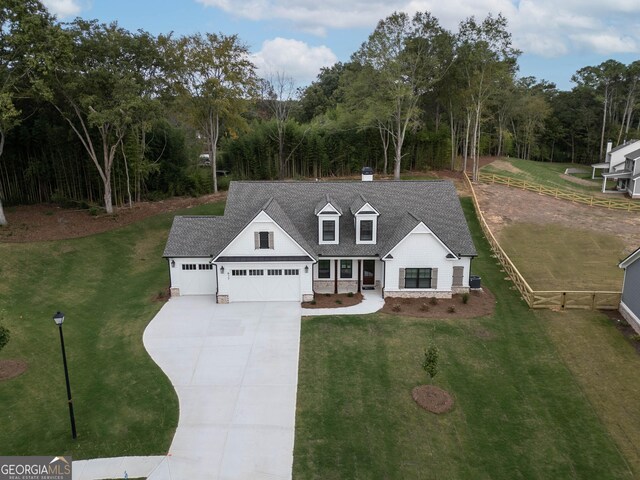 view of front of house with a front lawn and a garage