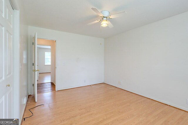 spare room featuring ceiling fan and light wood-type flooring