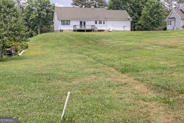 view of yard with a deck