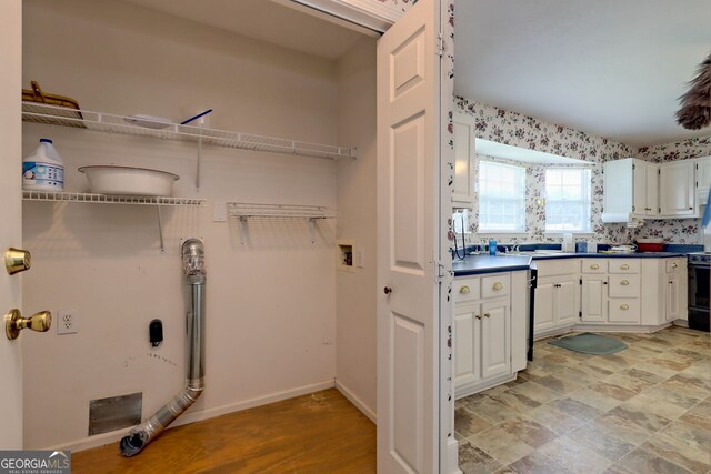 clothes washing area featuring sink and washer hookup