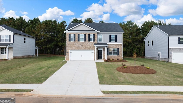 view of front of home with a front yard and a garage