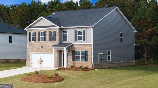 view of front of property featuring a front yard and a garage