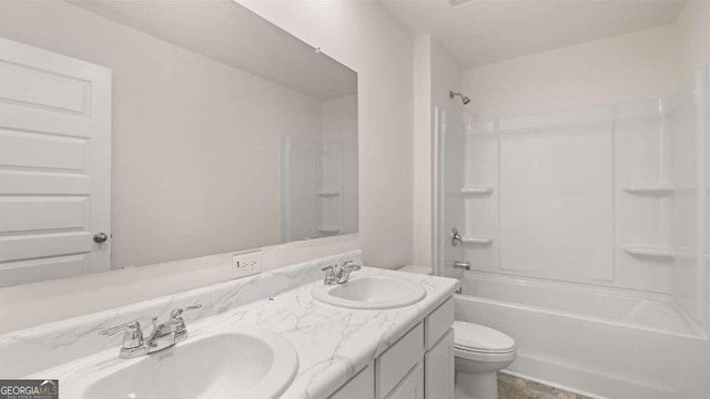 full bathroom featuring shower / washtub combination, vanity, and toilet