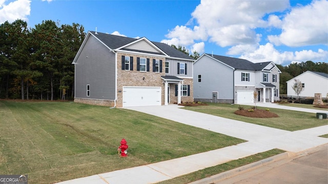 view of front of home featuring a garage and a front yard