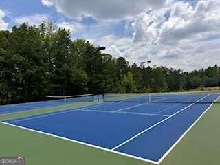 view of sport court featuring basketball hoop