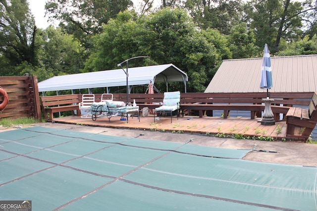 view of swimming pool with a wooden deck