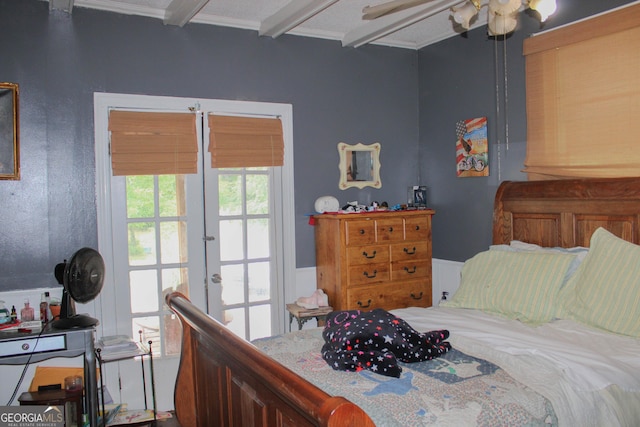 bedroom with beam ceiling and french doors