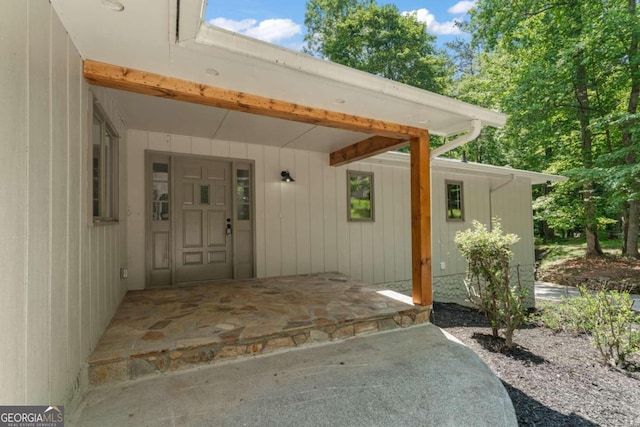 doorway to property with a carport