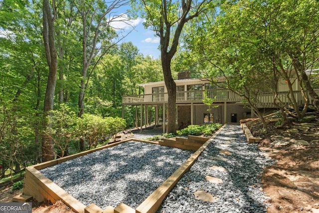 view of yard with a wooden deck