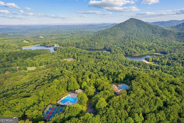 aerial view featuring a water and mountain view