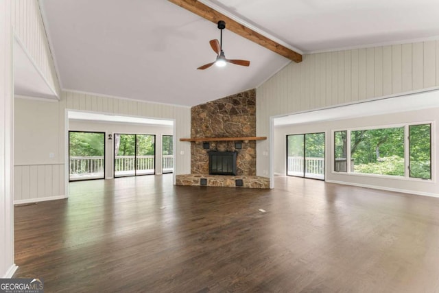 unfurnished living room featuring a stone fireplace, ceiling fan, vaulted ceiling with beams, and dark hardwood / wood-style flooring