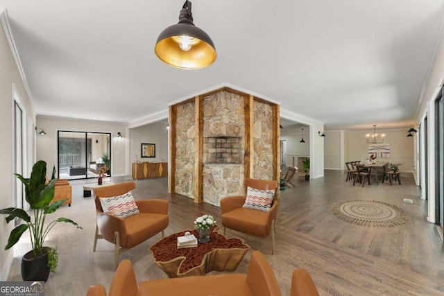 living room with ornamental molding and hardwood / wood-style flooring