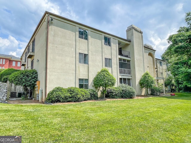 view of building exterior featuring central AC unit