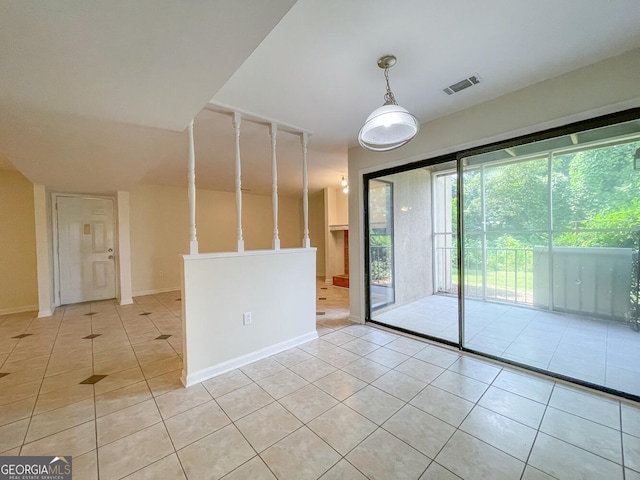 empty room with light tile patterned floors